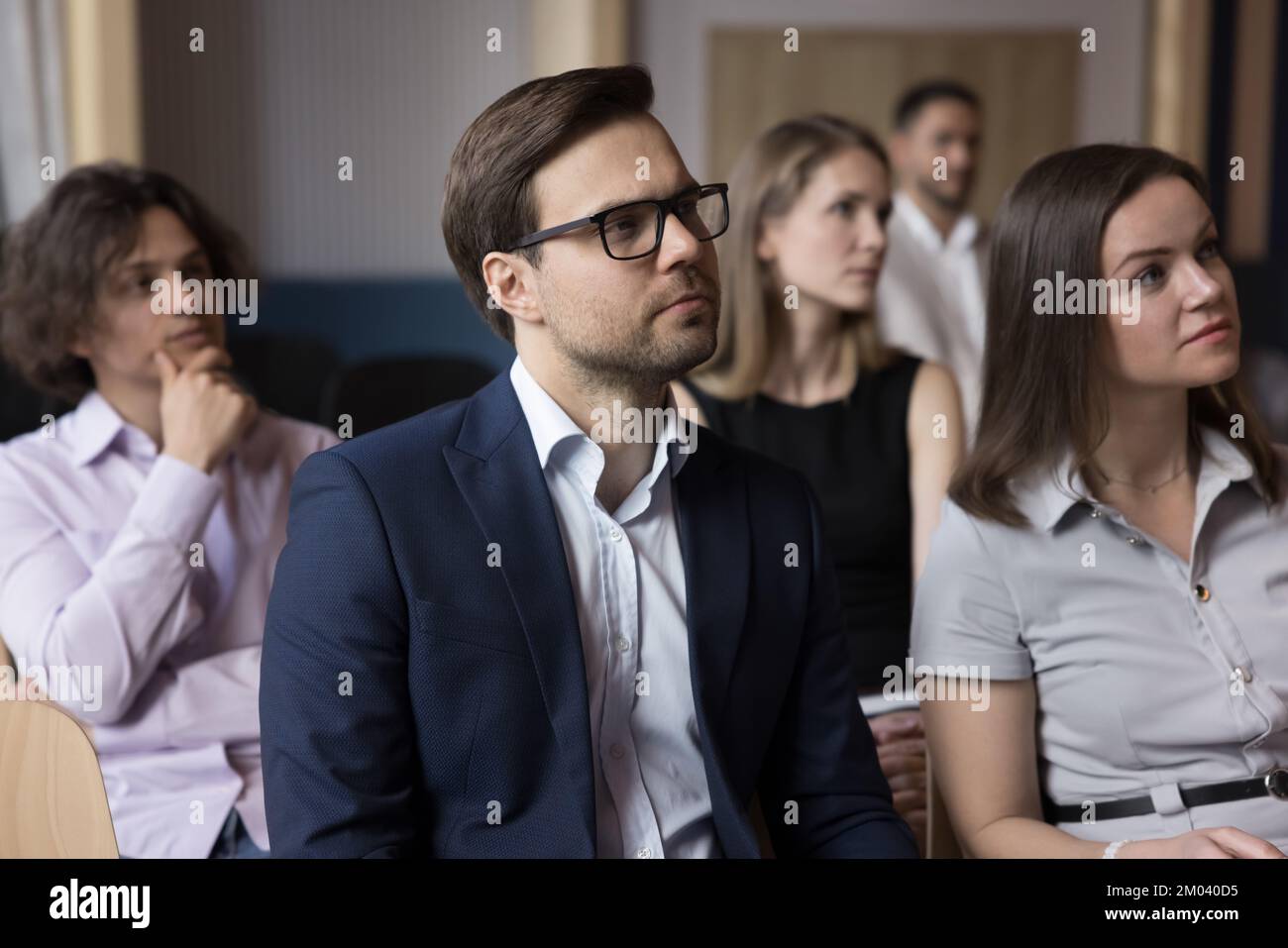 Group of businesspeople listening speech of business trainer Stock Photo