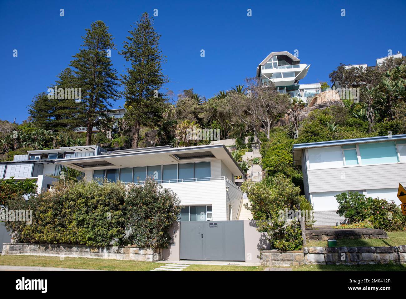 Palm Beach Sydney Australia and expensive homes overlooking the beach on a blue sky summers day