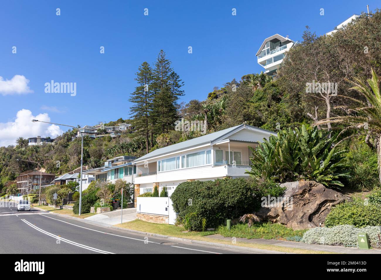 Palm Beach Sydney Australia and expensive homes overlooking the beach on a blue sky summers day