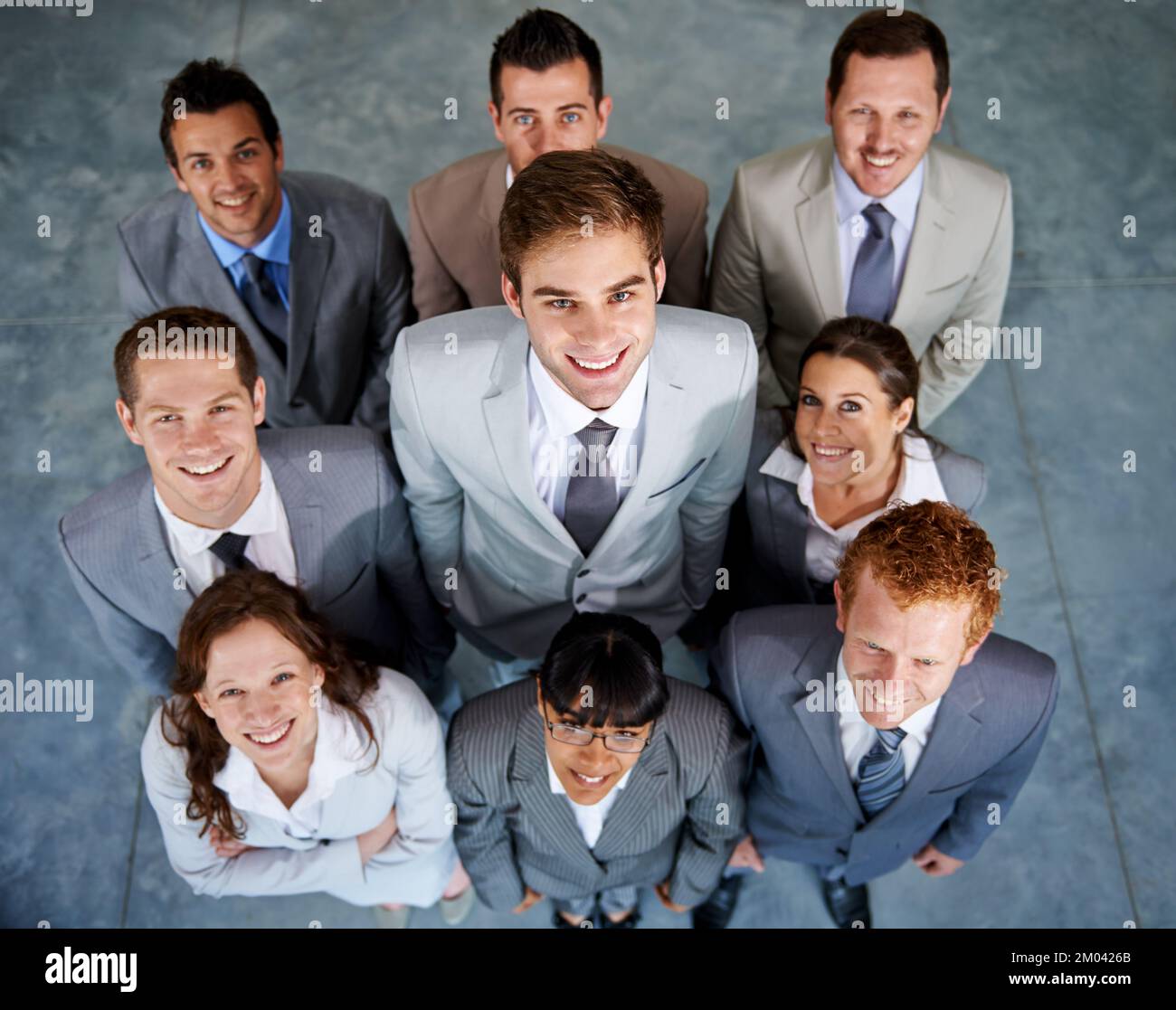 Winners. Top view of a group of smiling young business executives Stock ...