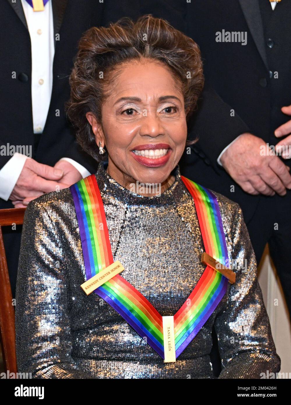 Tania León, one of the recipients of the 45th Annual Kennedy Center Honors  waits to pose for a group photo with his fellow honorees following the  Artists Dinner at the US Department