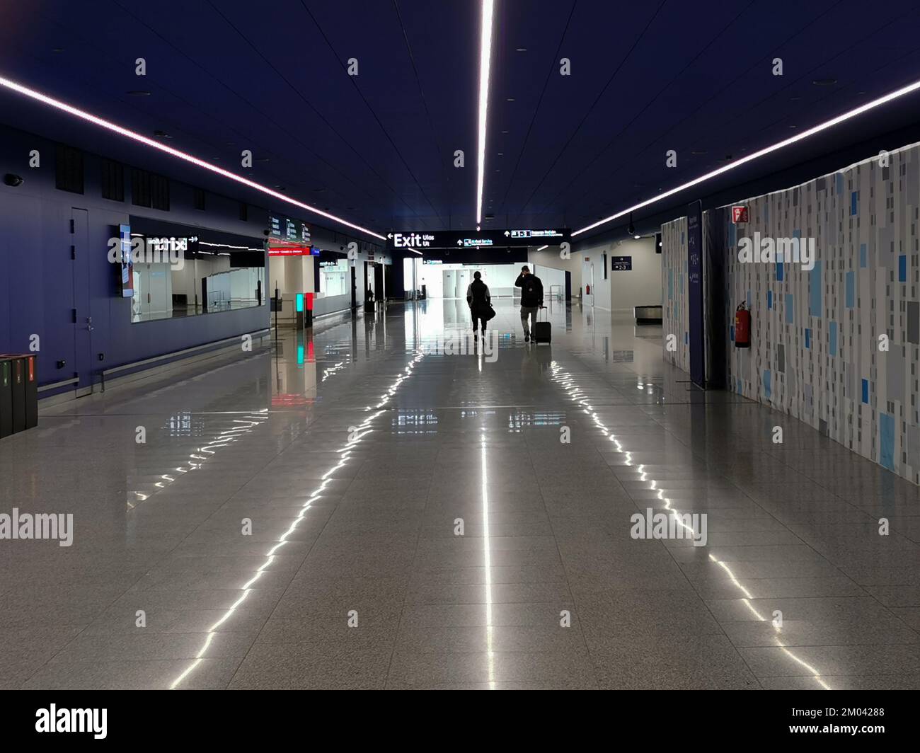 Travellers on departure and arrival terminal gate in a modern International airport of Helsinki finland . Stock Photo