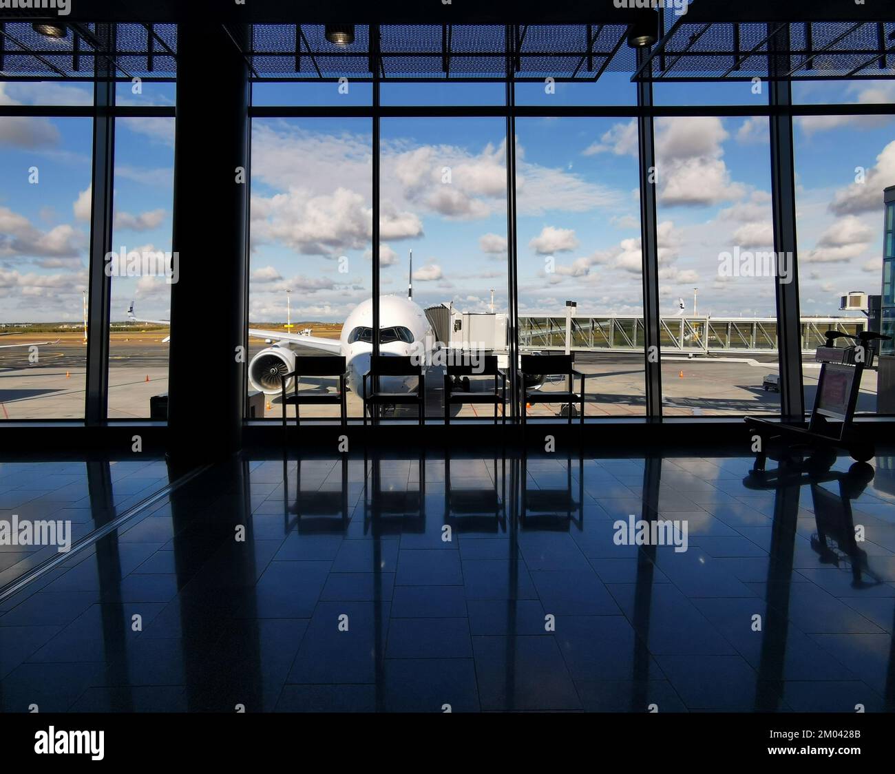 Departure and arrival terminal gate in a modern International airport of Helsinki finland . Stock Photo