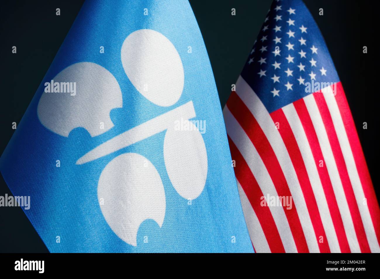KYIV, UKRAINE - November 28, 2022. OPEC and USA flags as a symbol of negotiations. Stock Photo