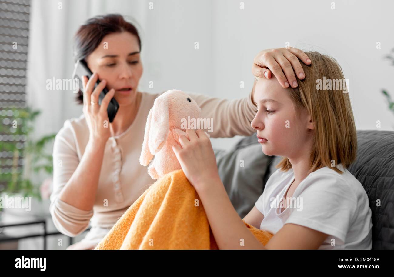 Mother with ill child Stock Photo