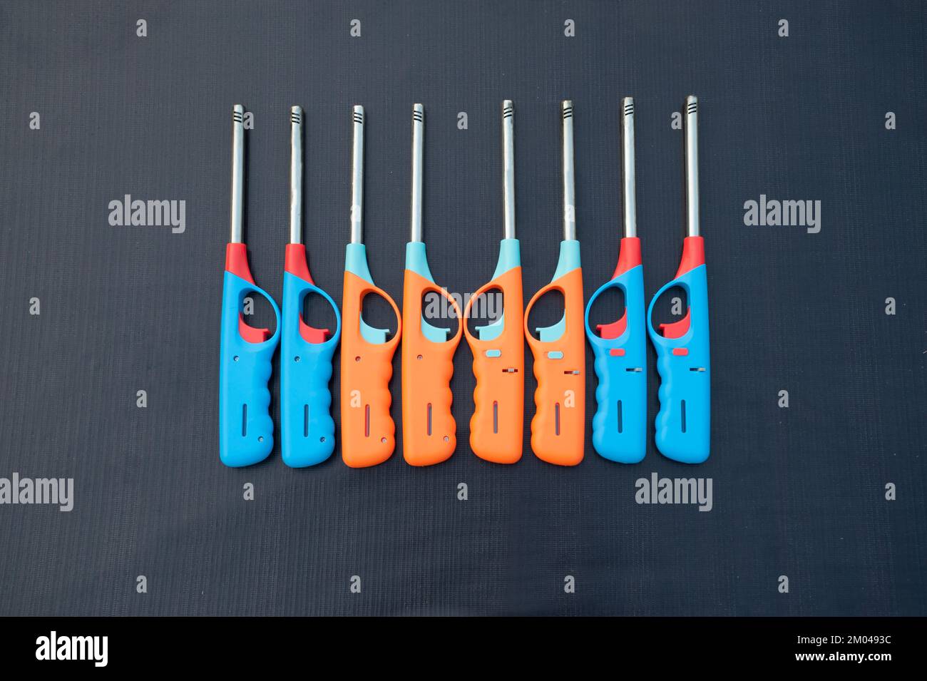 Group of colorful Gas lighter gun for gasstove on a black background Stock Photo Alamy