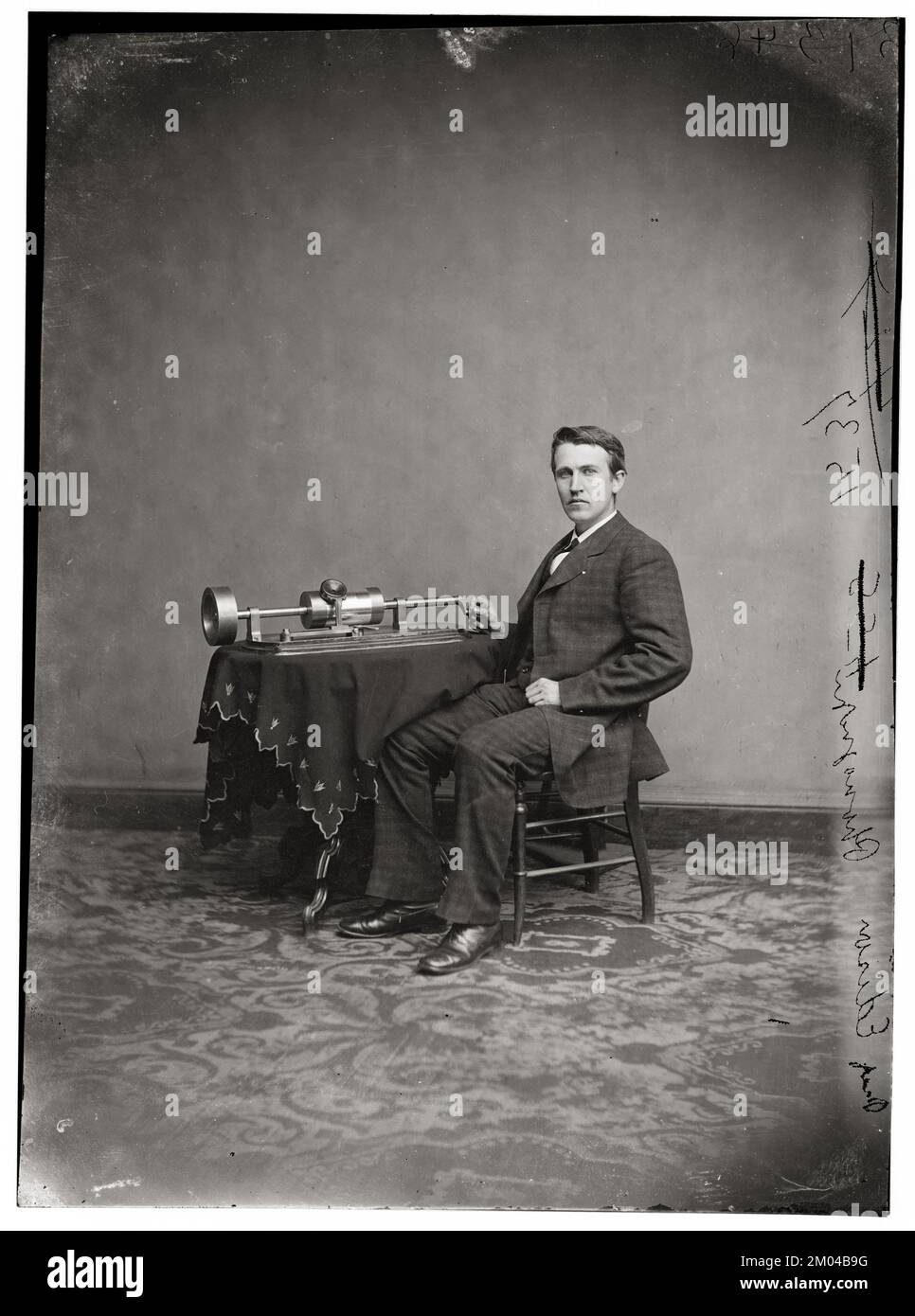 Thomas Alva Edison portrait, Glass negative, demonstrating his tinfoil phonograph, c 1877 Stock Photo