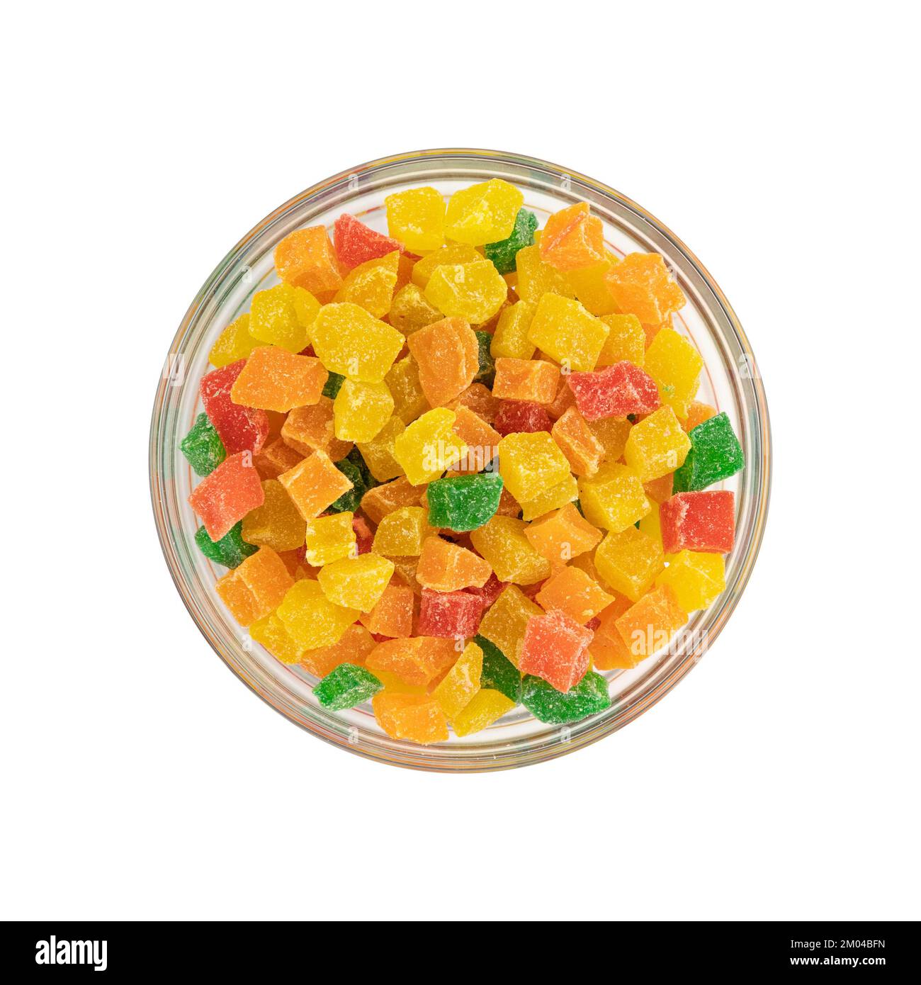 diced candied fruits in glass bowl isolated on white, peel of oranges ...