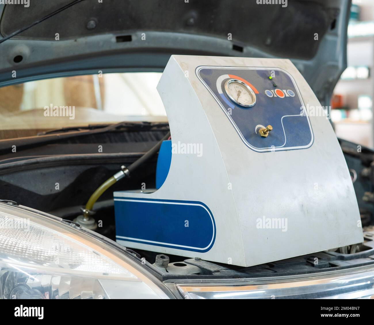 Automated change of brake fluid in a car service. Car Stock