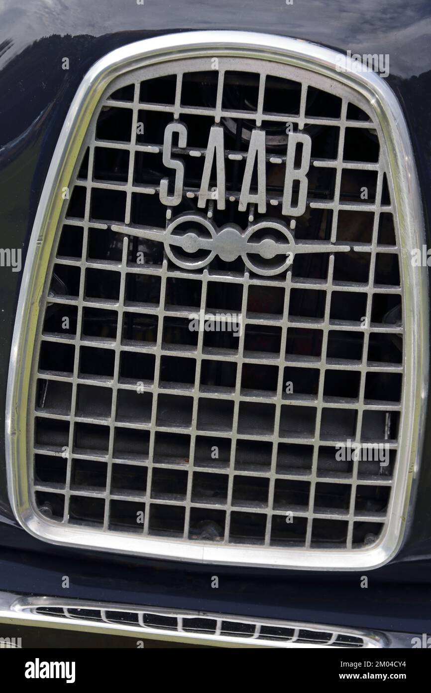 Saab car badge and aeroplane logo on radiator grille Stock Photo