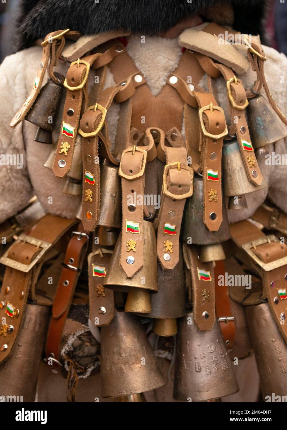 Rear view of a mysterious dancer wearing bells at the traditional ...
