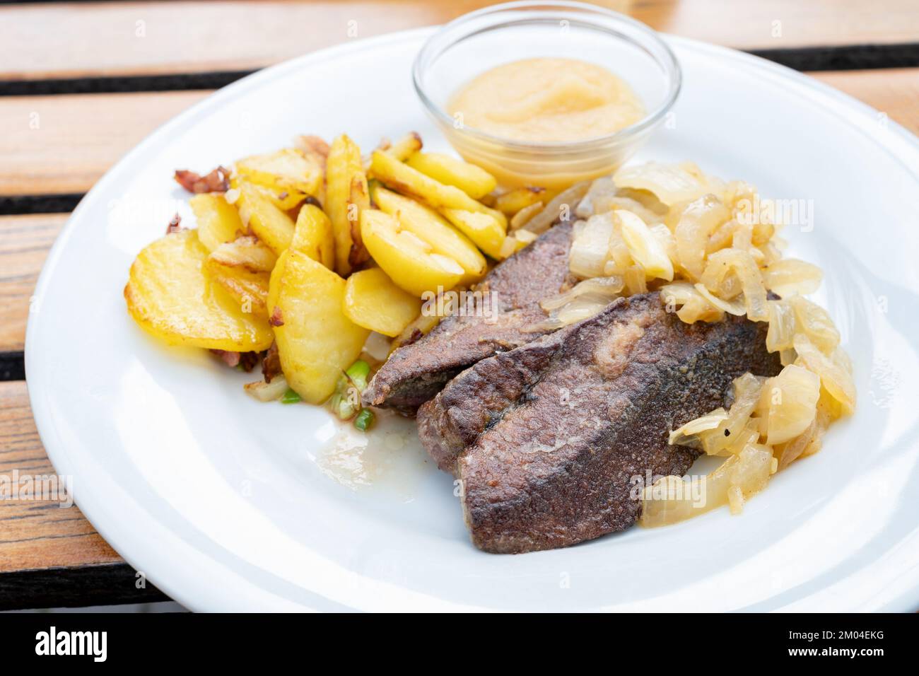 Fried calf liver with braised onions, roasted potatoes and apple puree