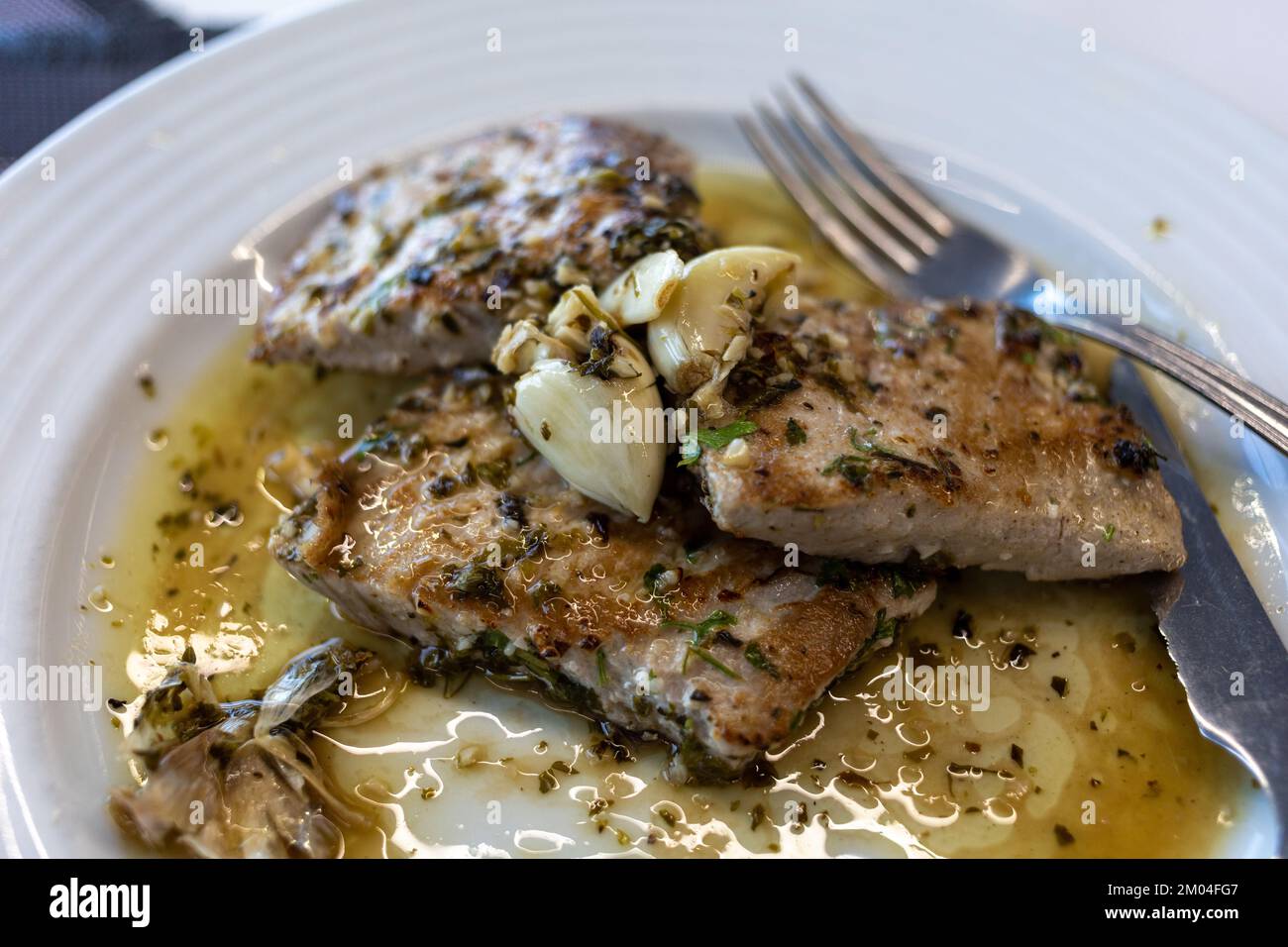 Grilled tuna steak in herb garlic and lemon marinade Stock Photo Alamy