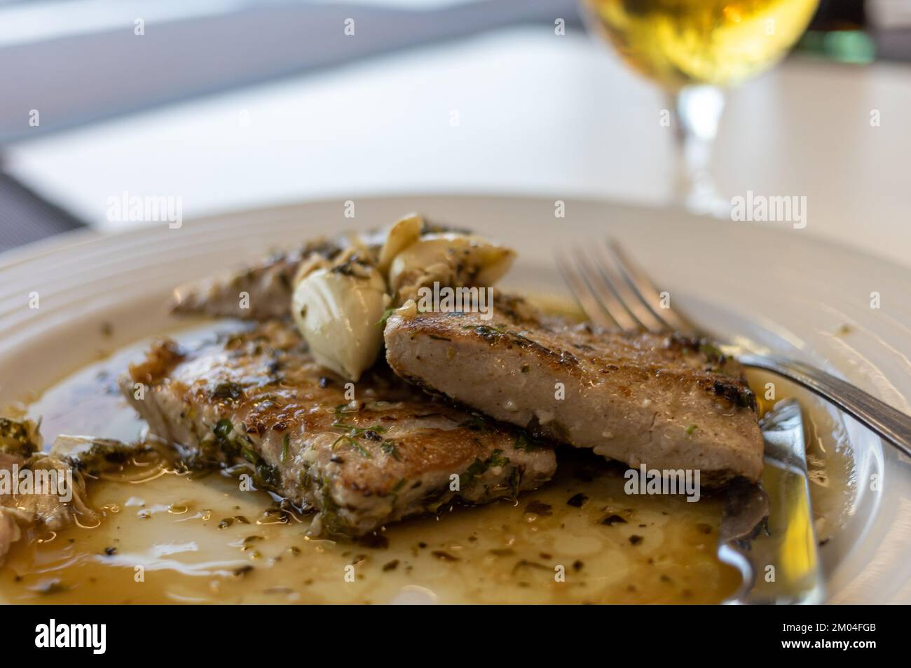 Grilled tuna steak in herb garlic and lemon marinade Stock Photo Alamy