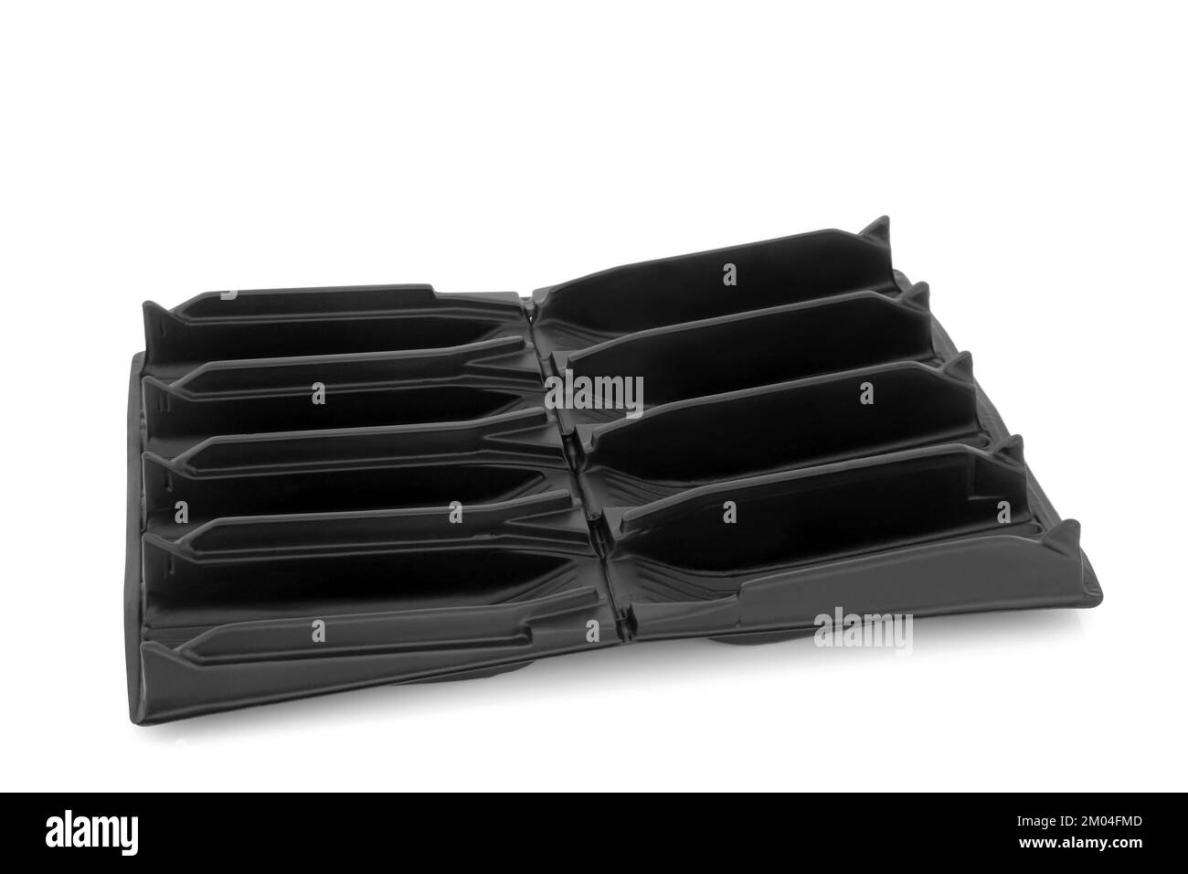 Root trainer for sowing seeds to develop root growth prior to planting. Open seedling module tray for gardening in black plastic on white background. Stock Photo