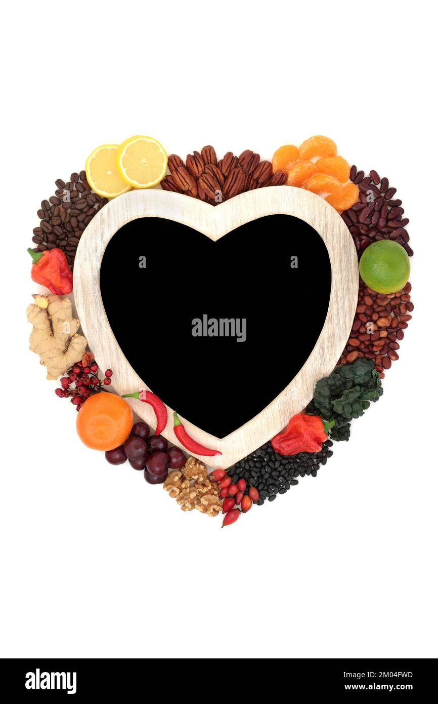 Heart shape wreath with health food high in flavonoids and polyphenols. Natural fruit and vegetables collection. Stock Photo