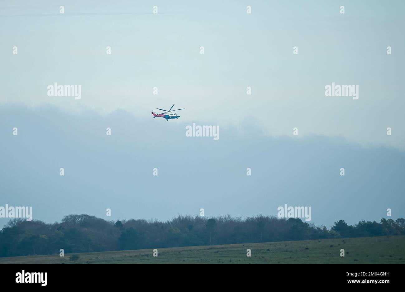 G-ETPP AugustaWestland AW139 training helicopter flying low on a military exercise, Wiltshire UK Stock Photo