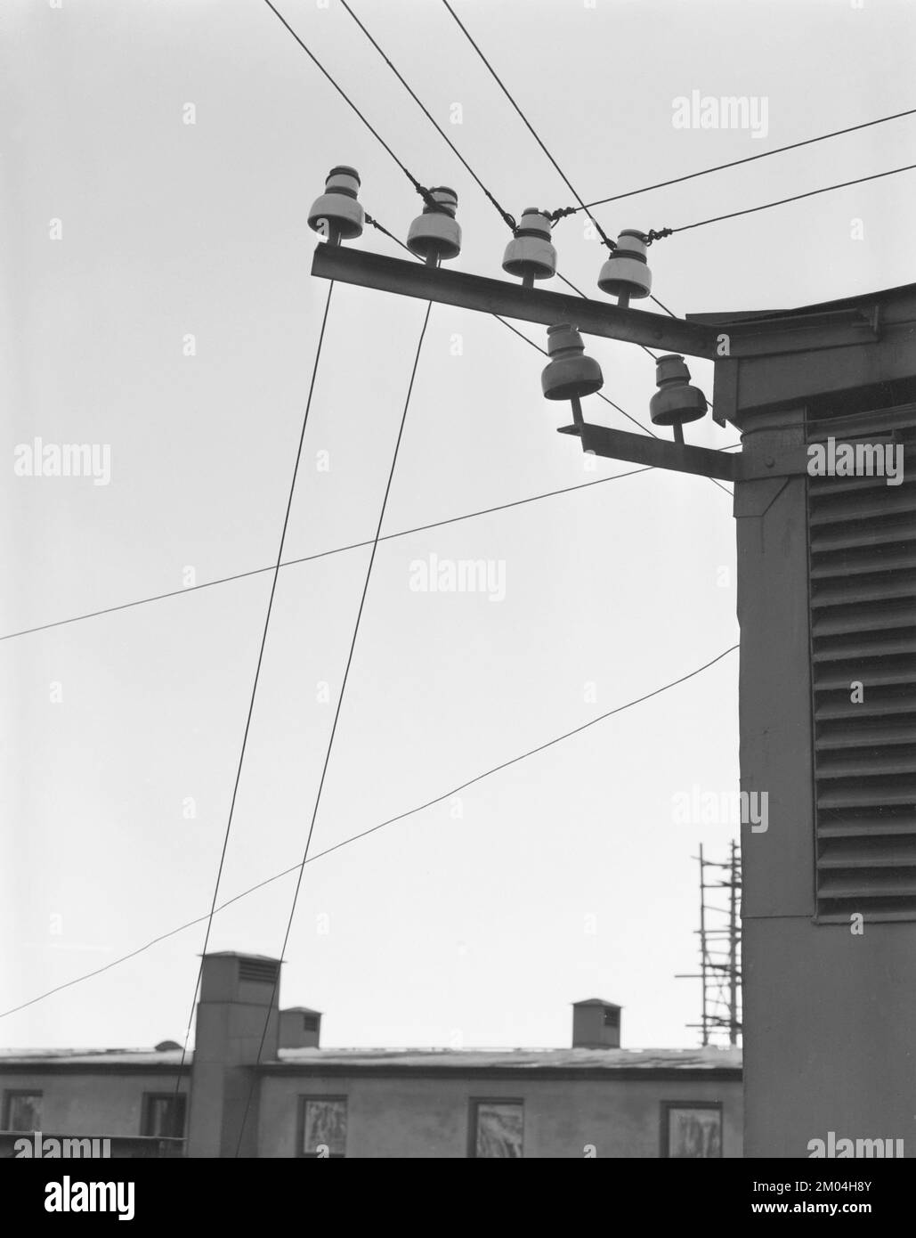 In the 1950s. Detail of electrical cables on a rooftop going in different directions. Sweden