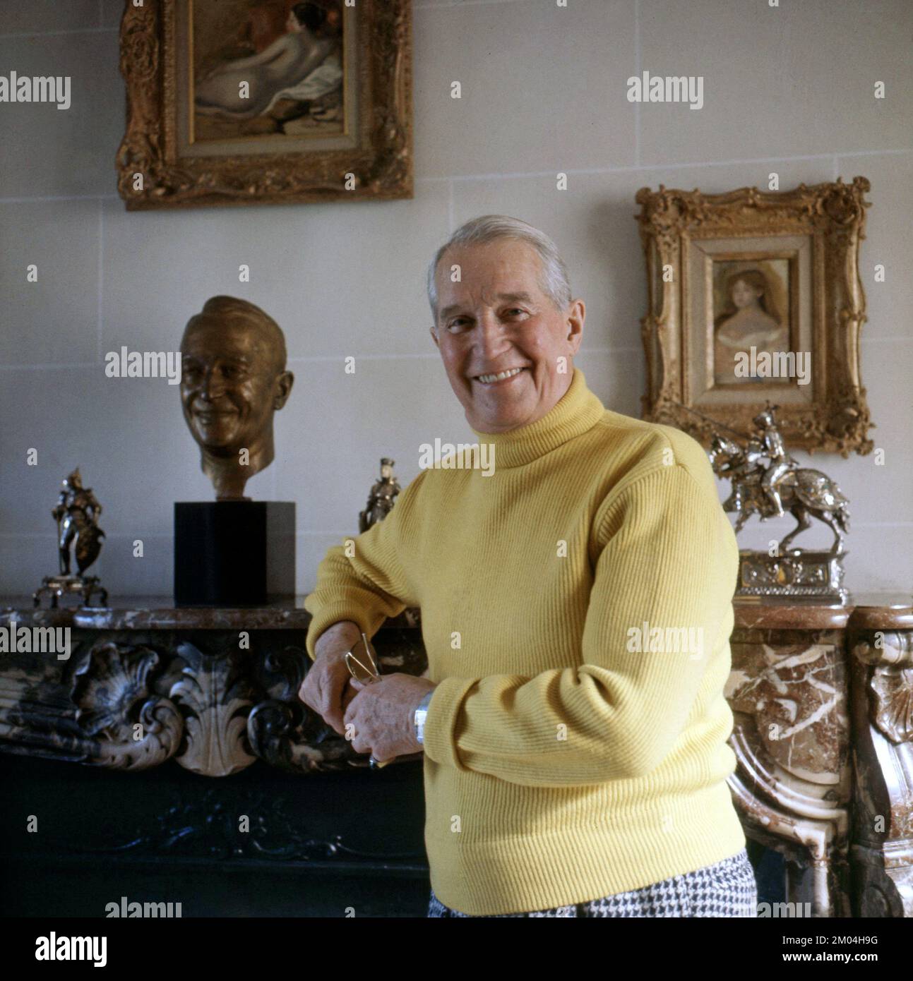 Maurice Chevalier. French actor 1888-1972. Pictured in his home in France 1964 Roland Palm ref 5:33:05 Stock Photo