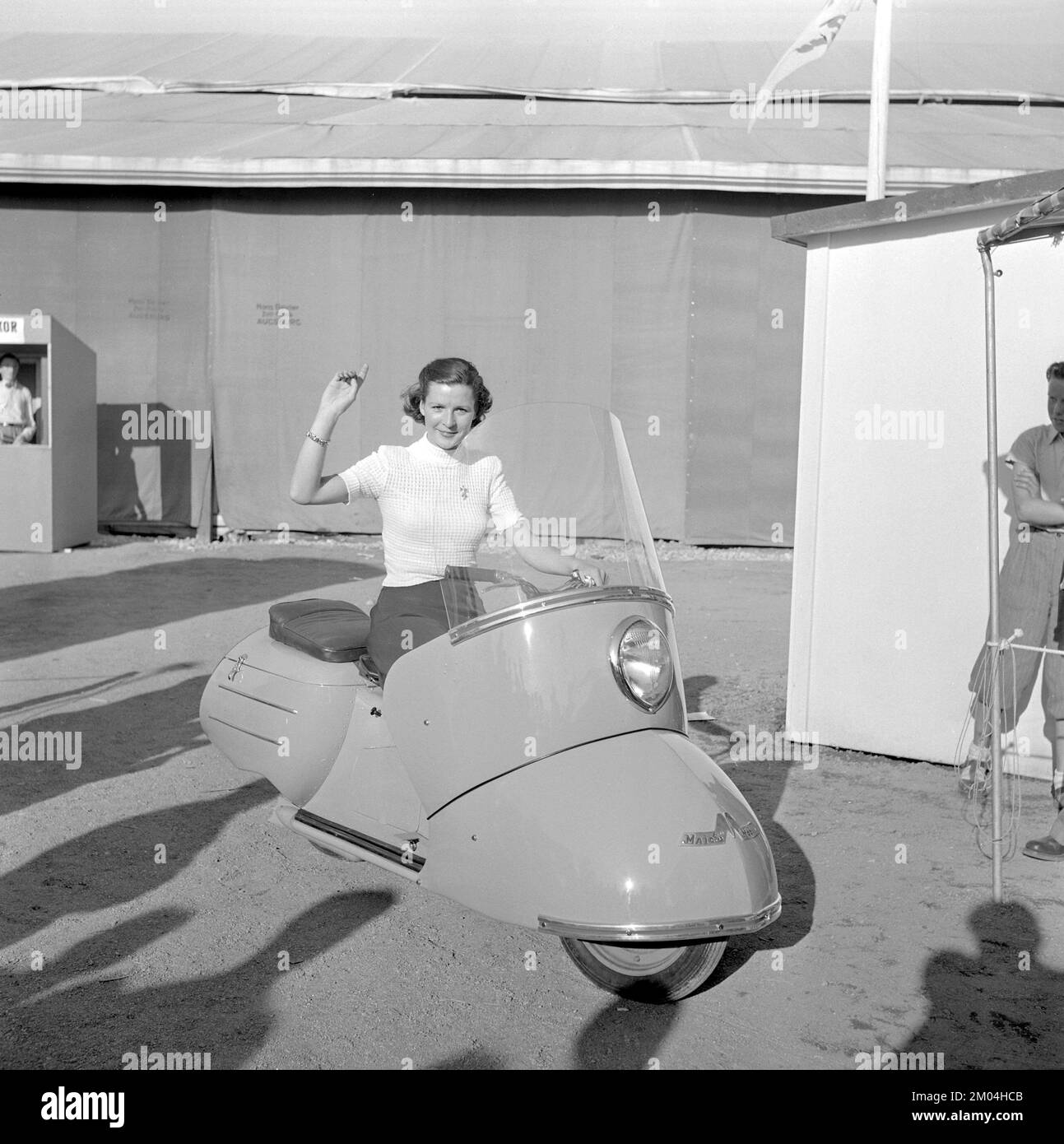 In the 1950s. A young woman seen on a german made scooter model Maico Mobil. Sweden 1951 Stock Photo