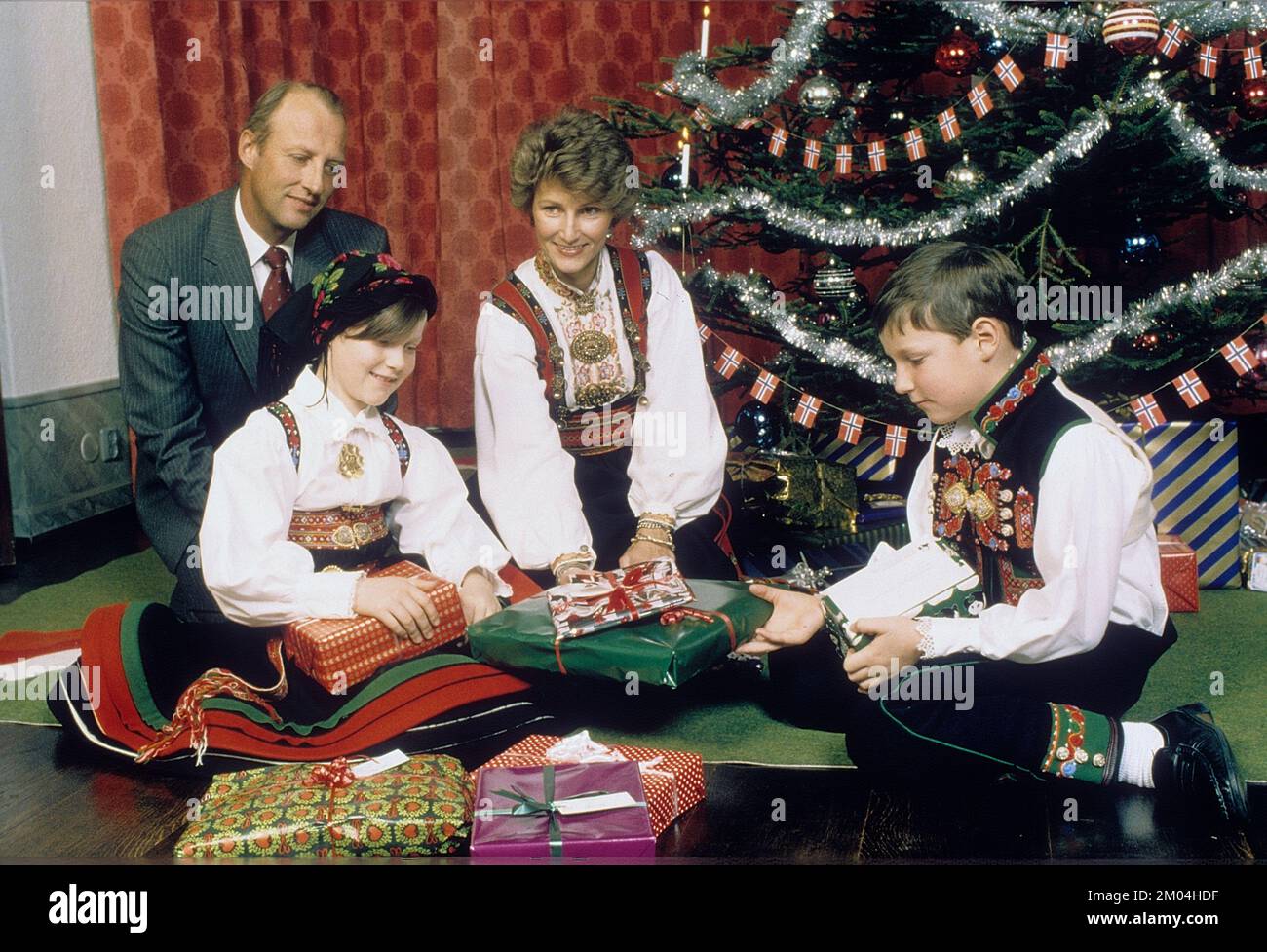 Norwegian royal family at christmas in the 1980s. Prince Harald of Norway, Sonja of Norway with her children Märtha Louise and Haakon Magnus. Stock Photo