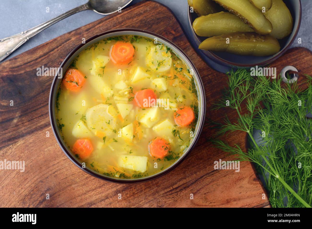 Cucumber soup - traditional Polish soup with pickled cucumbers, potatoes, carrots and dill Stock Photo