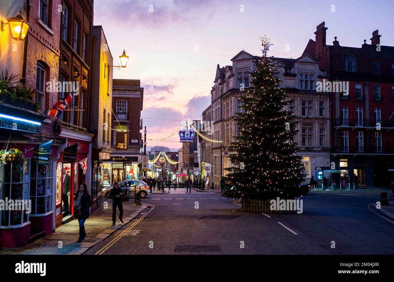 Christmas lights and shoppers in Royal Windsor Berkshire , England , UK