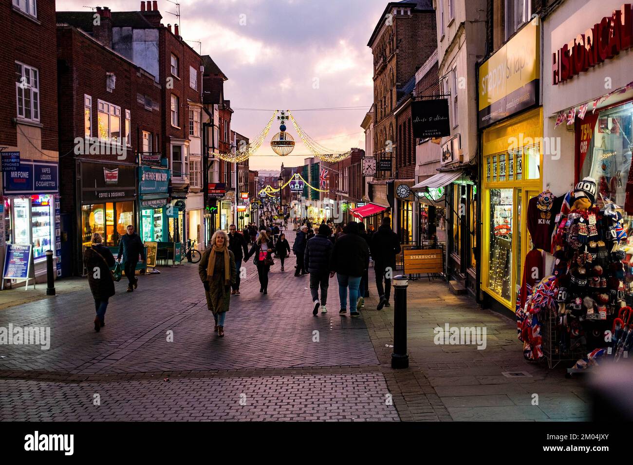 Christmas lights and shoppers in Royal Windsor Berkshire , England , UK