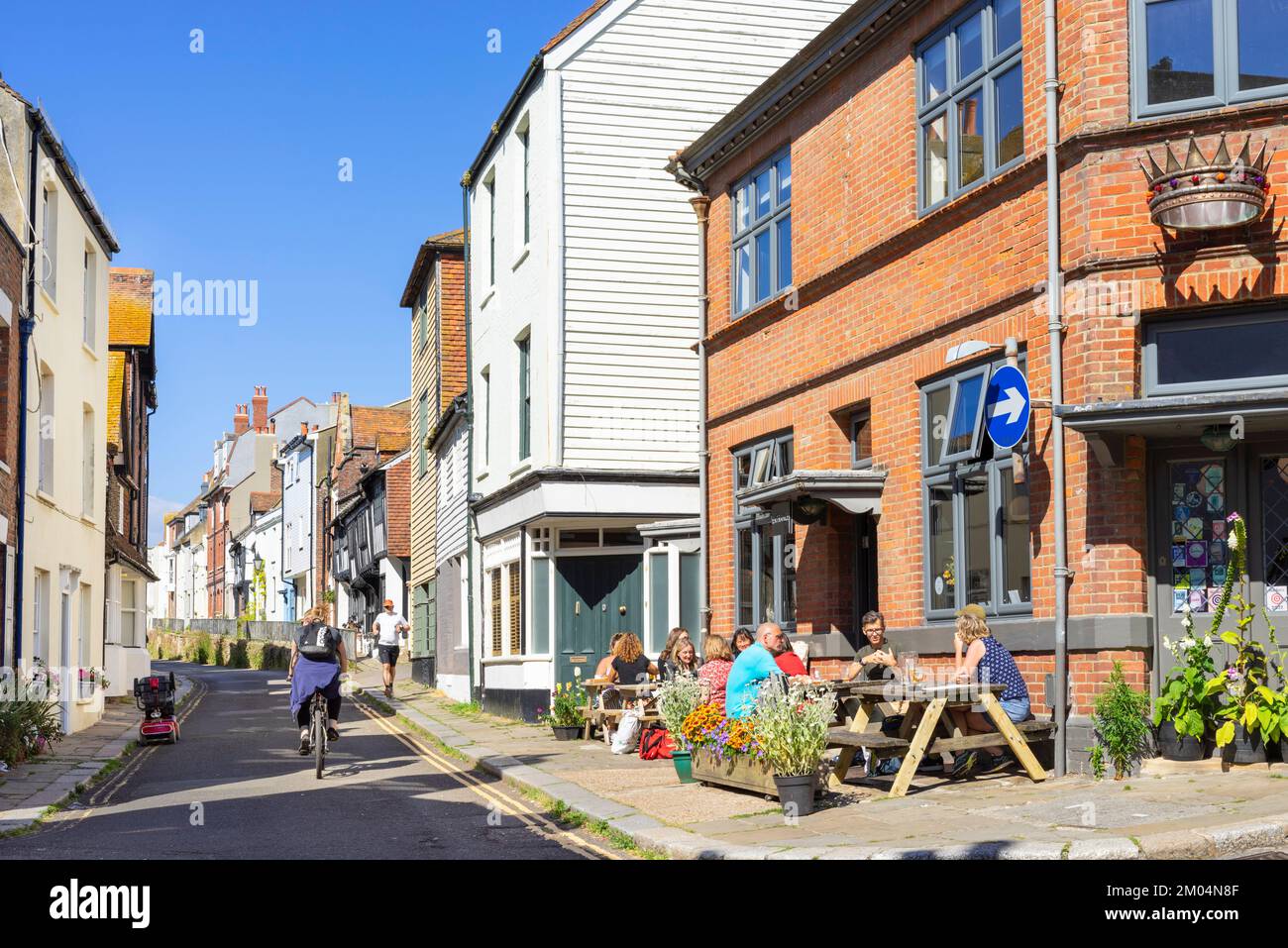Hastings Old Town All Saints street people sat outside the pub The Crown public house Hastings East Sussex England UK GB Europe Stock Photo