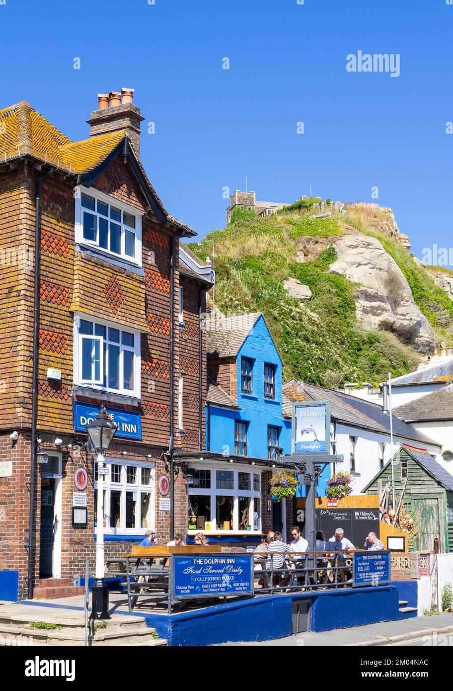 Hastings people sat outside the Dolphin Inn on Rock-a-nore road Hastings old Town Hastings East Sussex England UK GB Europe Stock Photo
