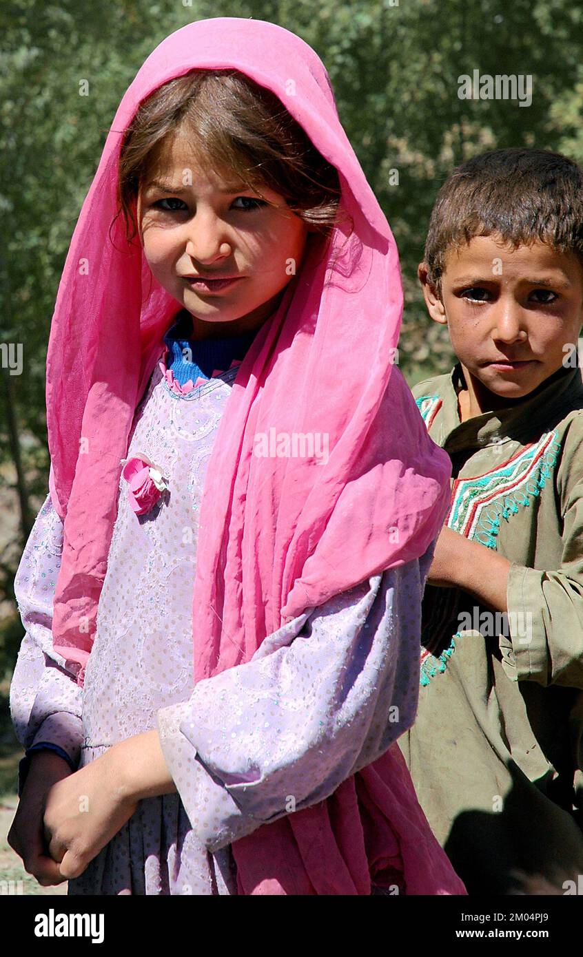Nomad settlement near the Minaret of Jam, Ghor Province /Afghanistan: Children wearing traditional clothes. Nomads are still common in this region. Stock Photo