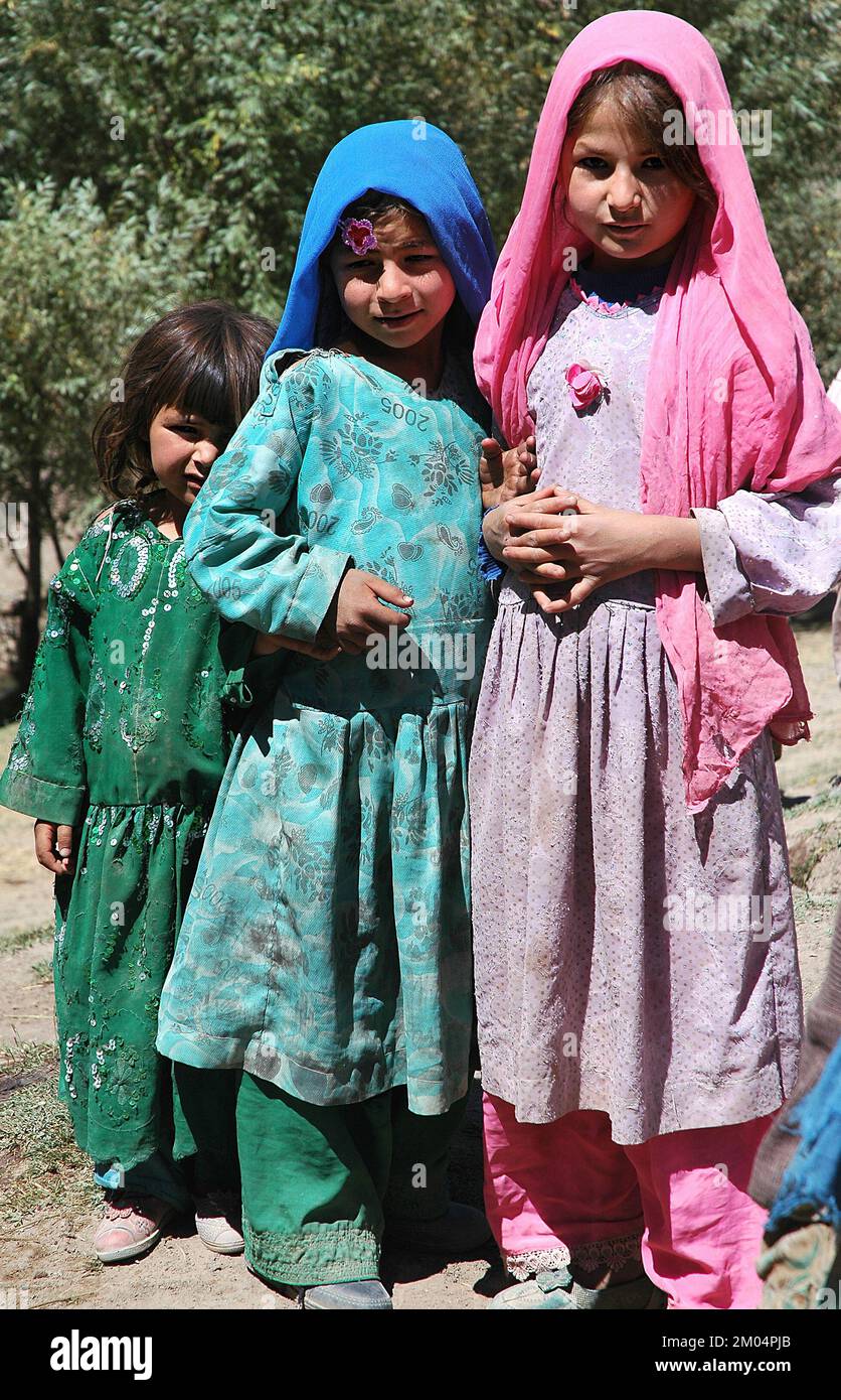 Nomad settlement near the Minaret of Jam, Ghor Province /Afghanistan: Children wearing traditional clothes. Nomads are still common in this region. Stock Photo