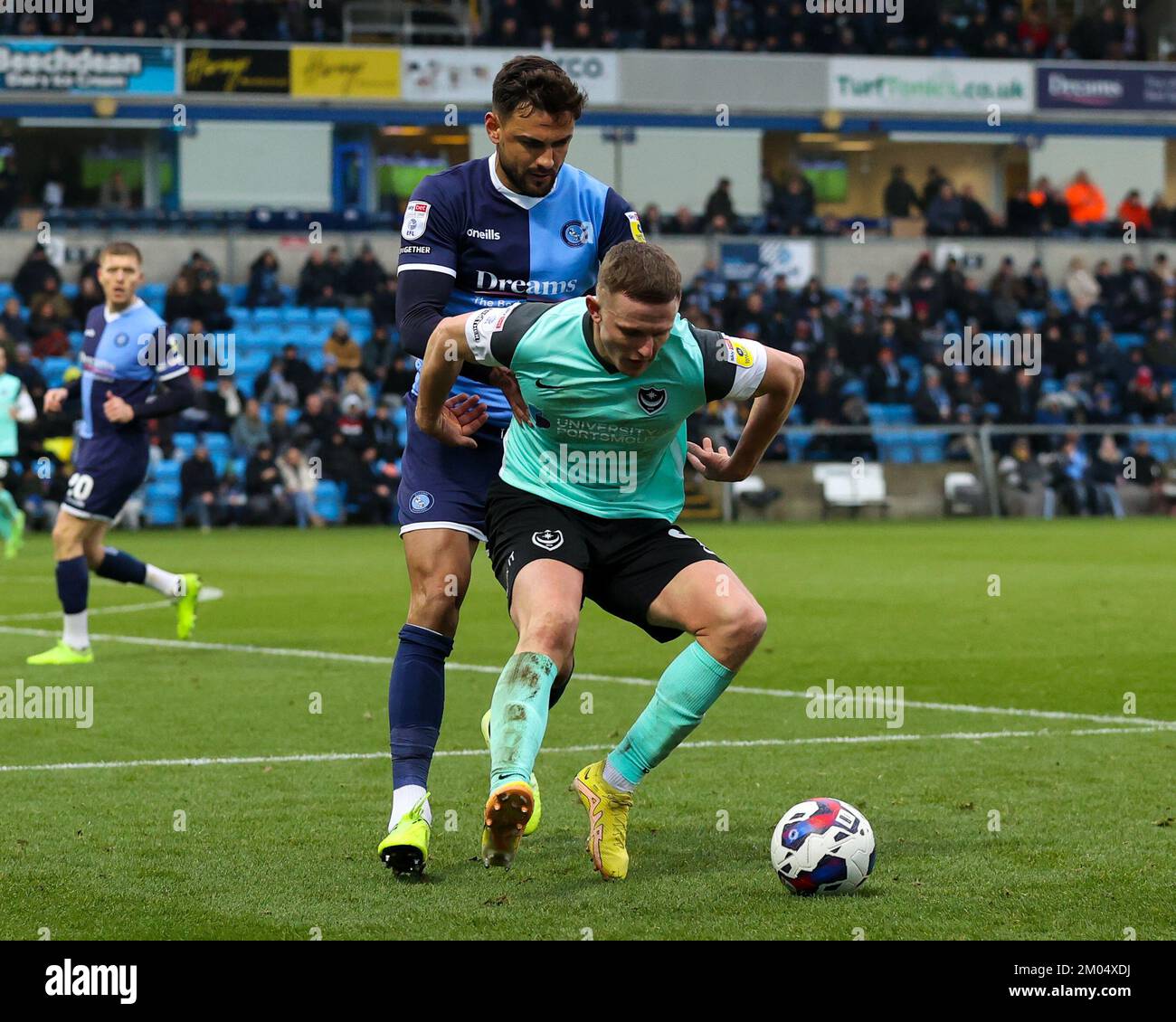 Colby Bishop of Portsmouth FC shields the ball from Ryan Tafazolli of Wycombe Wanderers during the Sky Bet League 1 match Wycombe Wanderers vs Portsmouth at Adams Park, High Wycombe, United Kingdom, 4th December 2022  (Photo by Nick Browning/News Images) Stock Photo