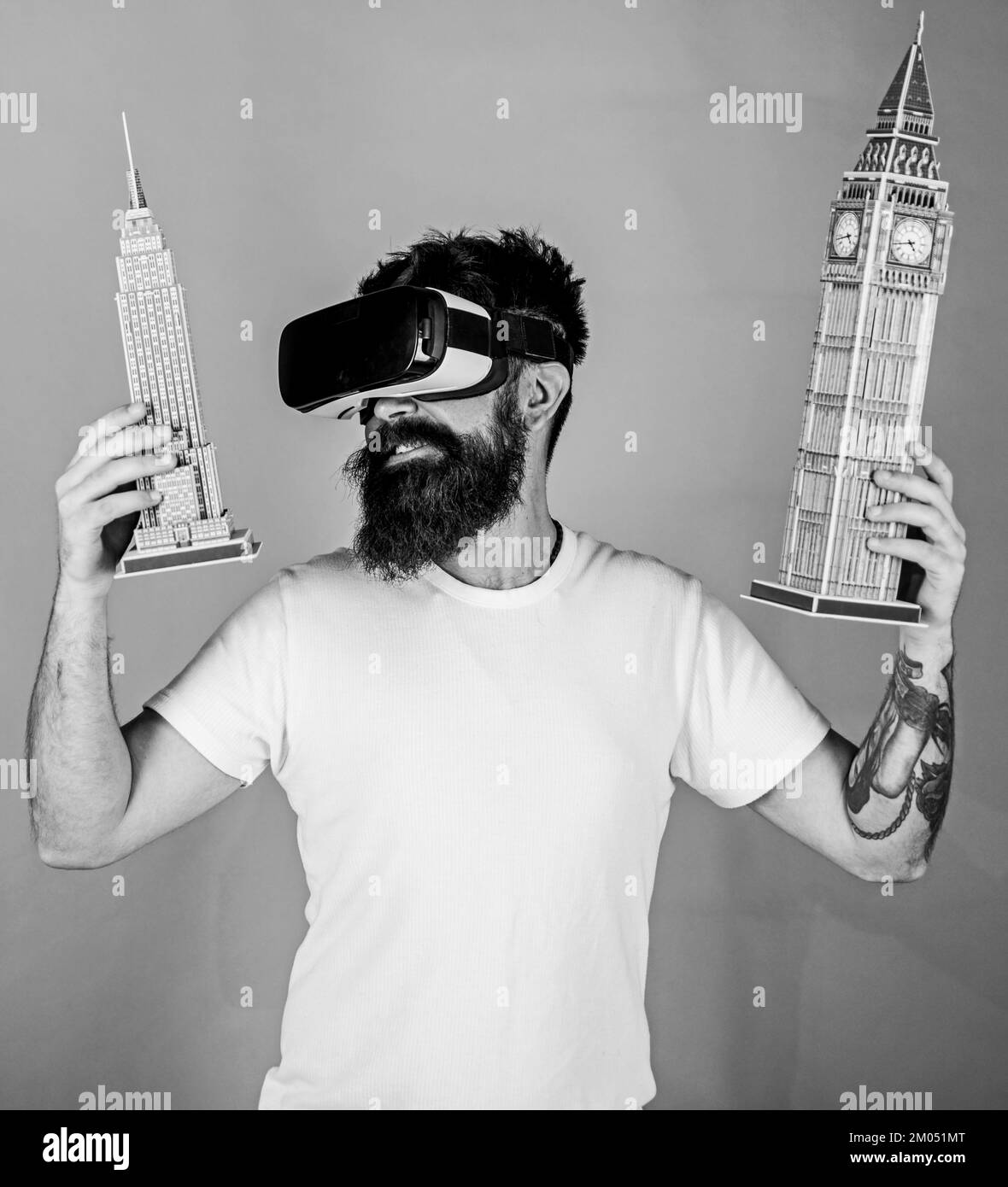 3D design concept. Man with beard in VR glasses, green background. Guy