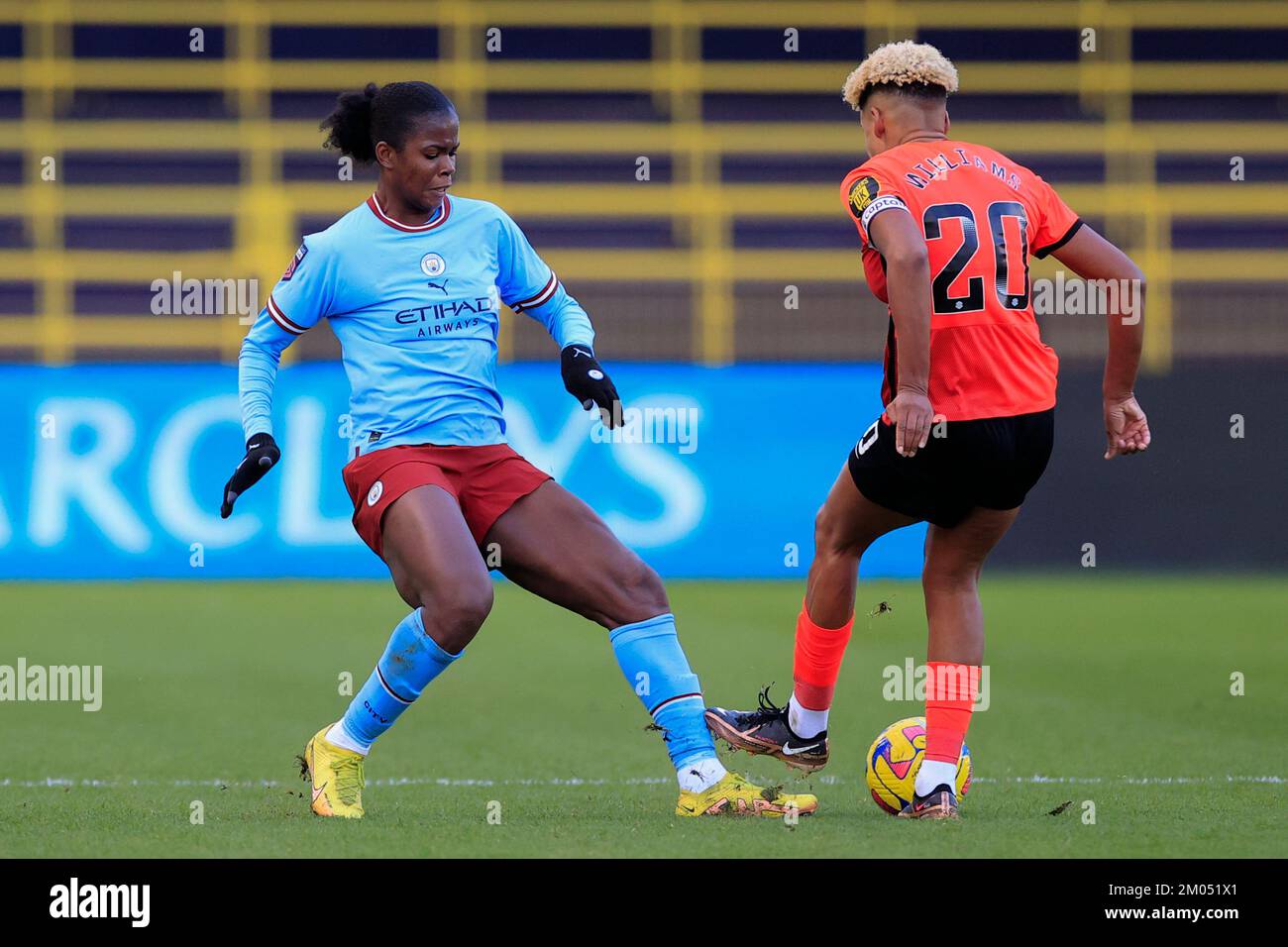 Khadija Shaw #21 of Manchester City and Victoria Williams #20 of Brighton challenge for the ball during The FA Women's Super League match Manchester City Women vs Brighton & Hove Albion W.F.C. at Etihad Campus, Manchester, United Kingdom, 4th December 2022  (Photo by Conor Molloy/News Images) Stock Photo