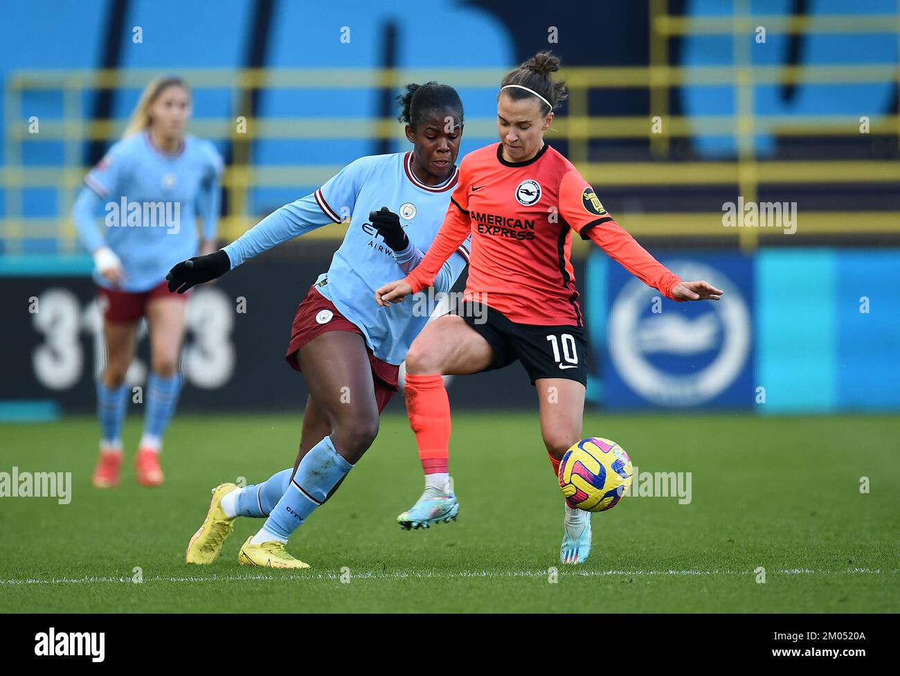 Manchester City's Khadija Shaw and Brighton and Hove Albion's Julia Zigiotti Olme battle for the ball during the Barclay Women's Super League match at the Manchester City Academy Stadium, Manchester. Picture date: Sunday December 4, 2022. Stock Photo