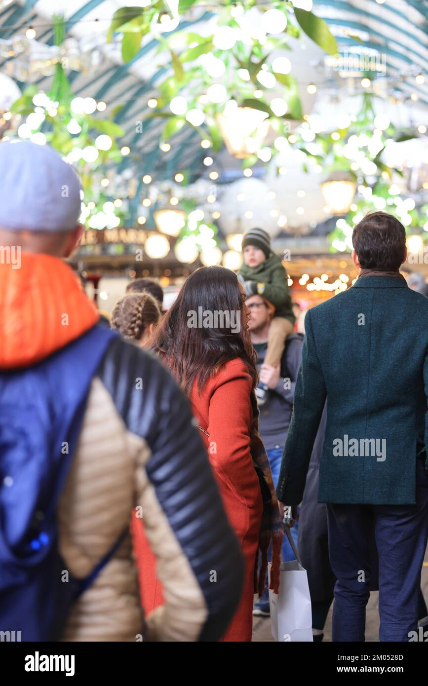 The Apple Market in Covent Garden, very busy in the Christmas season, 2022, despite the cost of living crisis, in central London, UK Stock Photo