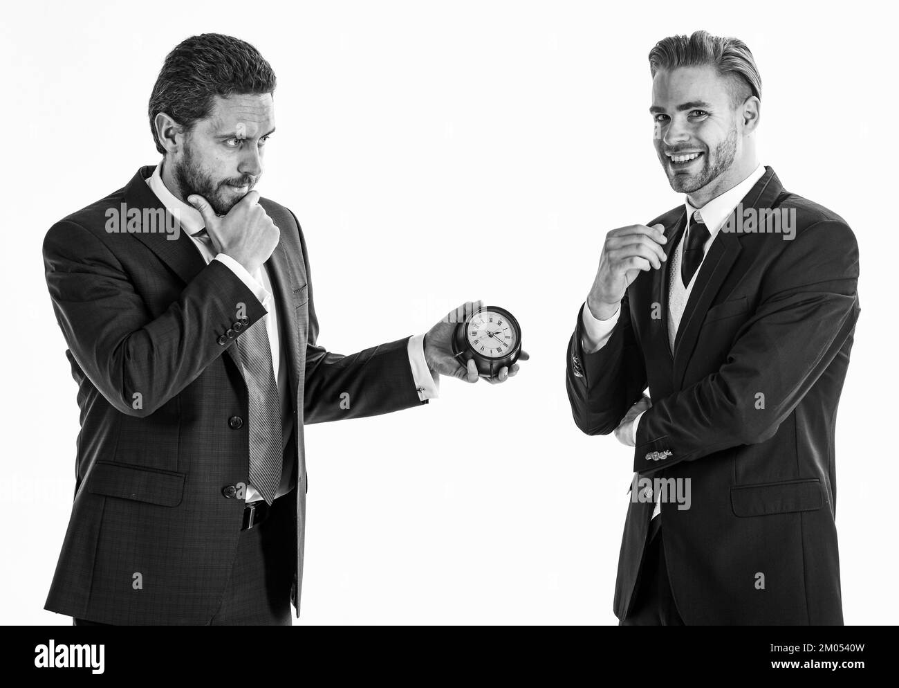 Business and punctuality concept. Businessmen misunderstanding a Stock Photo