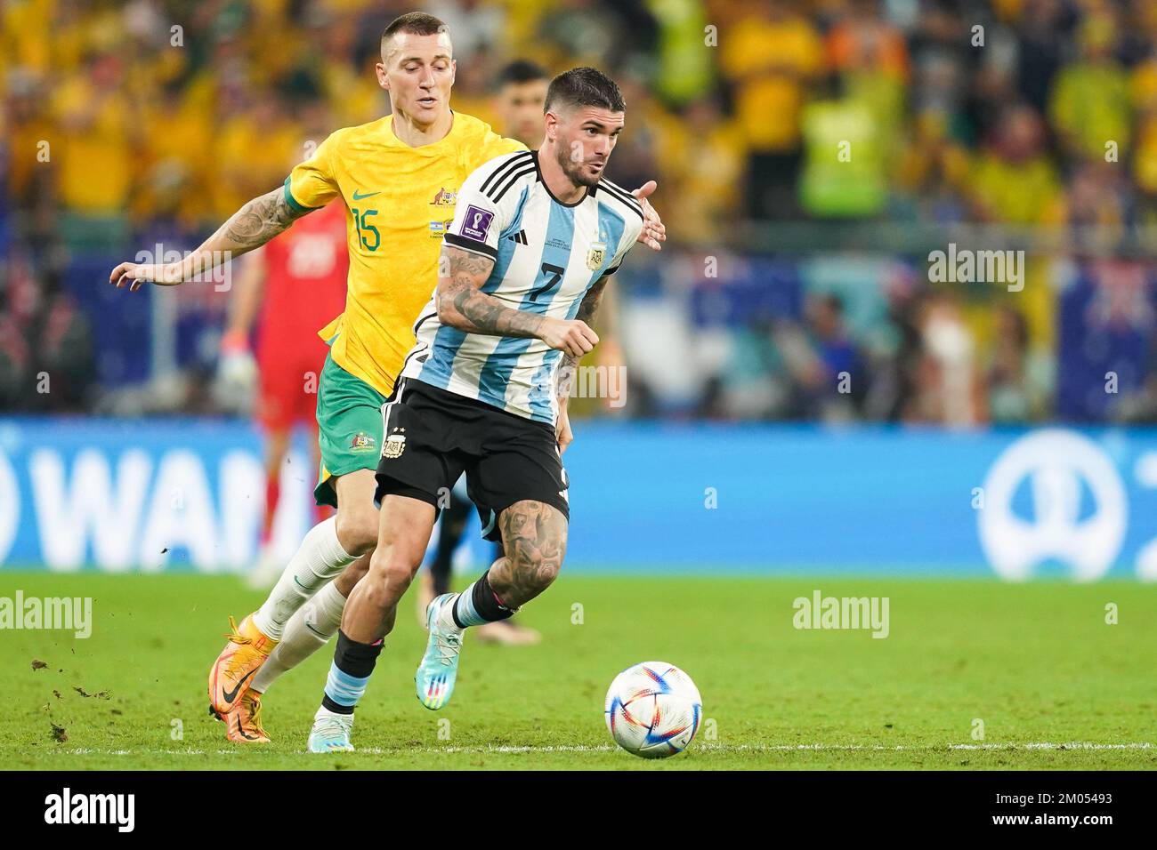 DOHA, QATAR - DECEMBER 3: Player of Argentina  Rodrigo De Paul fights for the ball with player of Australia Mitchell Duke during the FIFA World Cup Qatar 2022 Round of 16 match between Argentina and Australia at Ahmad bin Ali Stadium on December 3, 2022 in Al Rayyan, Qatar. (Photo by Florencia Tan Jun/PxImages) Stock Photo