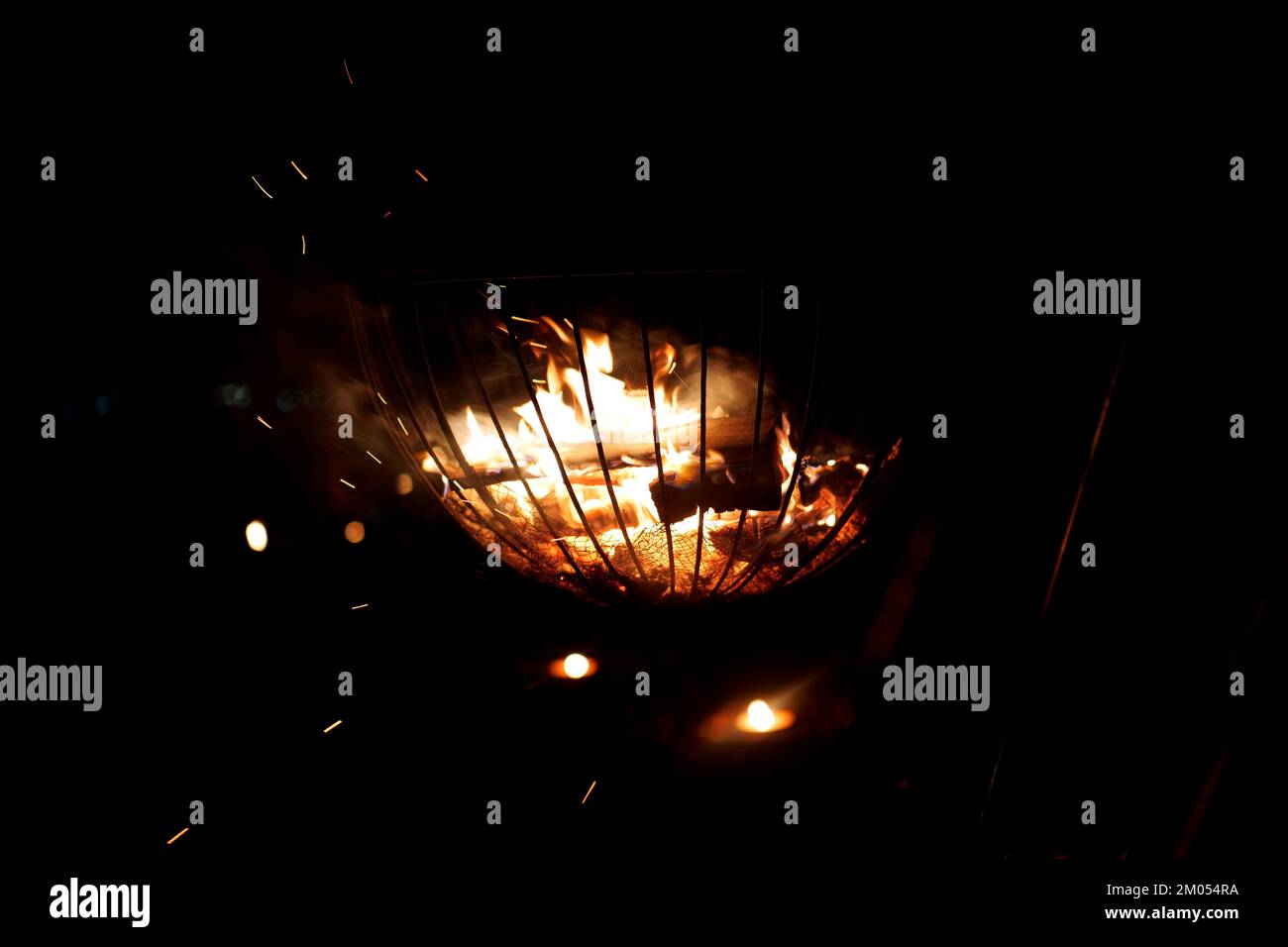 Fire basket with candles at winter market Stock Photo