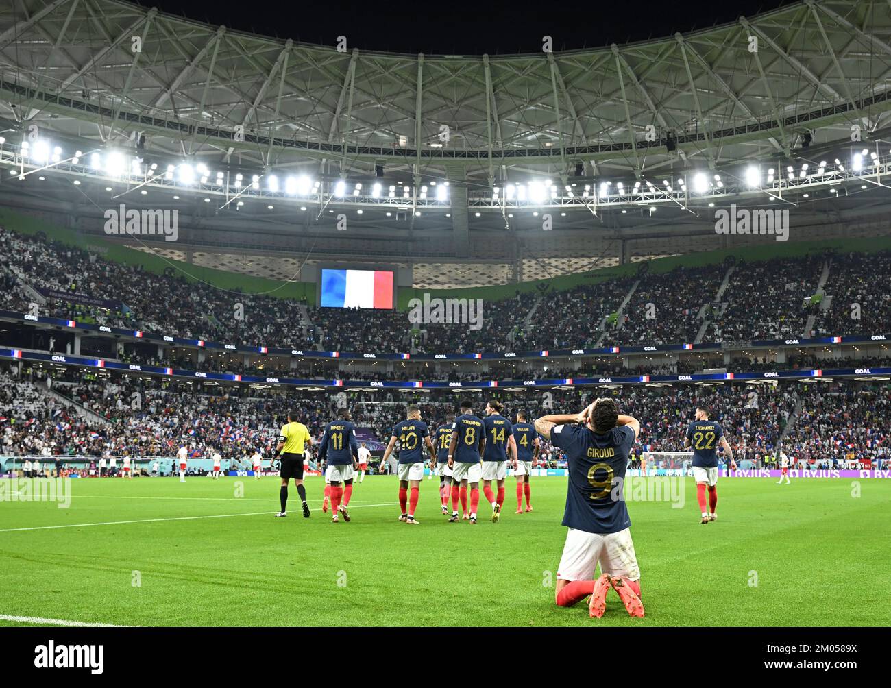 Doha, Qatar. 4th Dec, 2022. Olivier Giroud (front) of France celebrates his goal during the Round of 16 match between France and Poland of the 2022 FIFA World Cup at Al Thumama Stadium in Doha, Qatar, Dec. 4, 2022. Credit: Xiao Yijiu/Xinhua/Alamy Live News Stock Photo