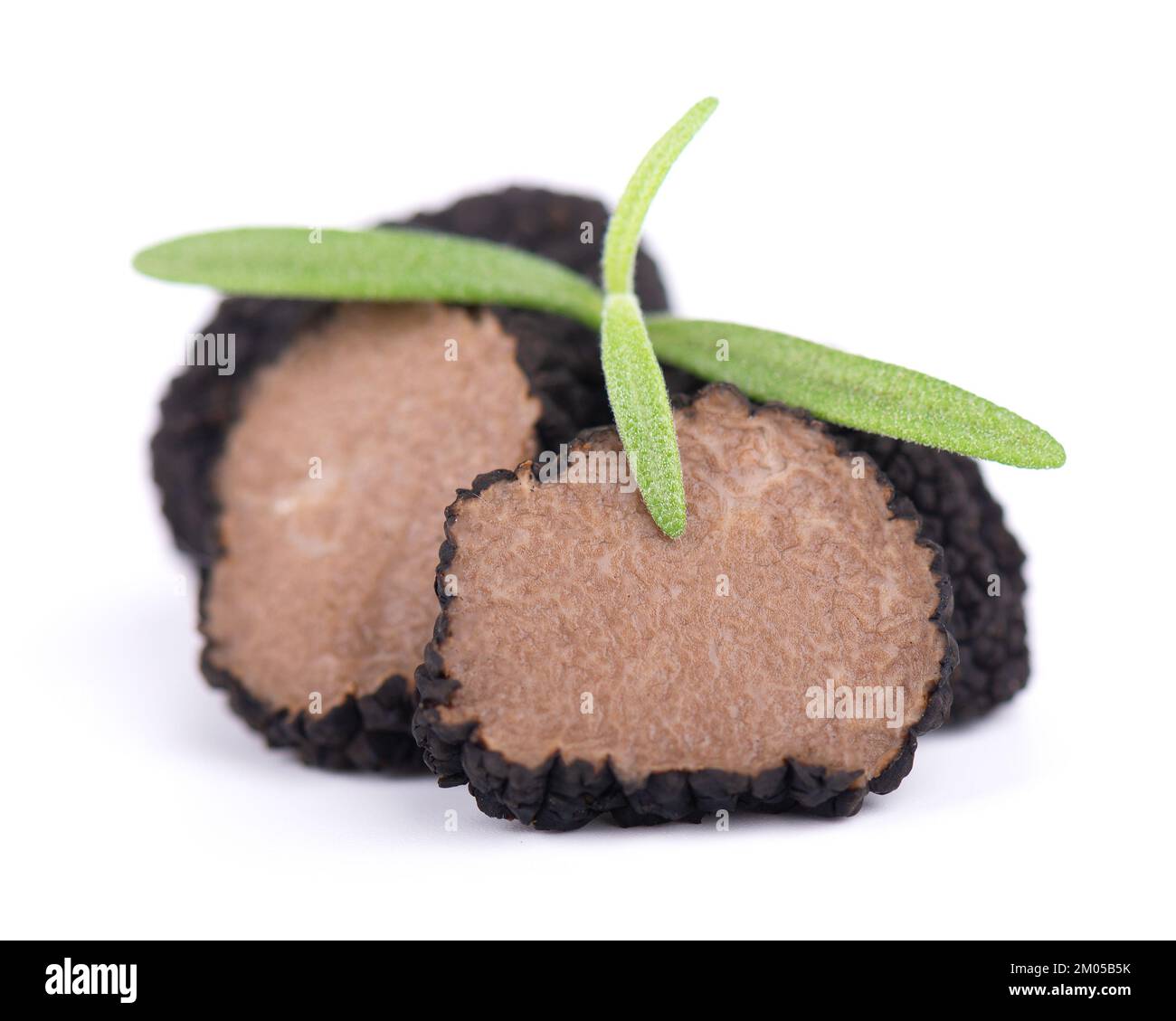 Black truffles isolated on a white background. Fresh sliced truffle