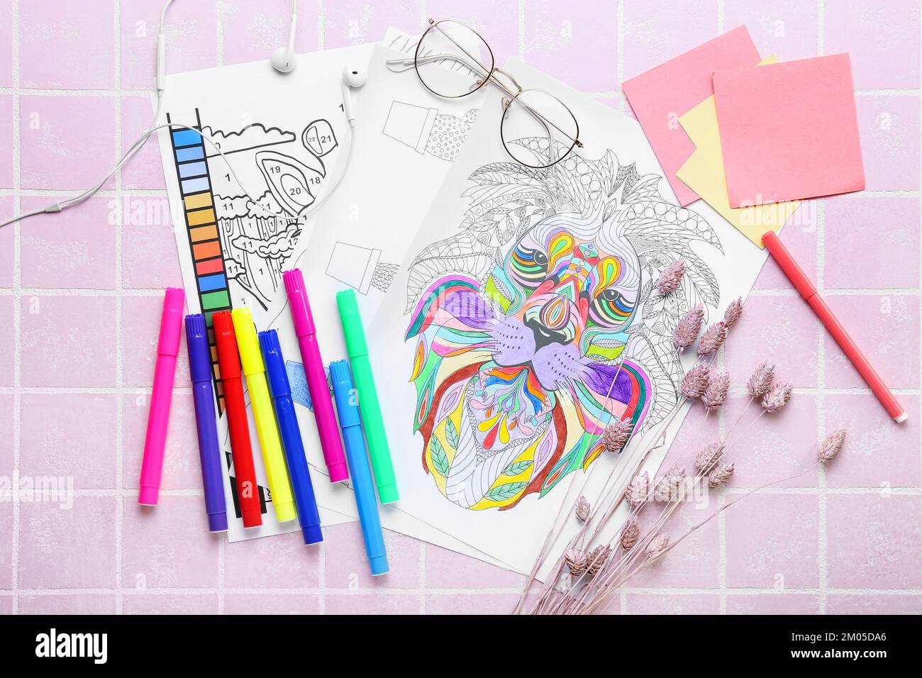 Coloring pages, felttip pens, dried flowers, sticky notes and