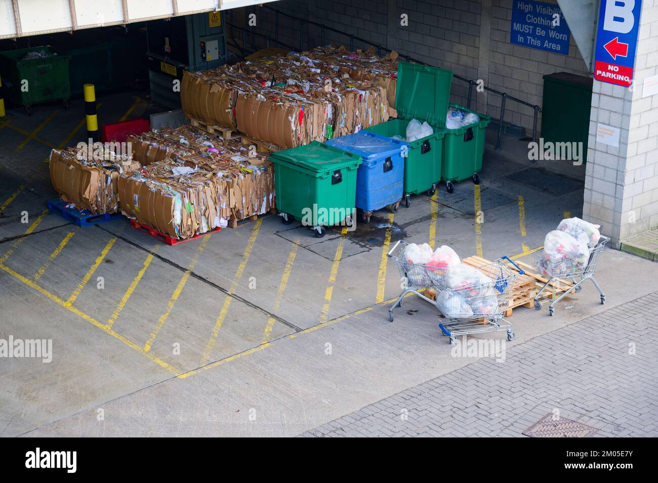 Cardboard and rubbish in waste compound for disposal at dump site Stock