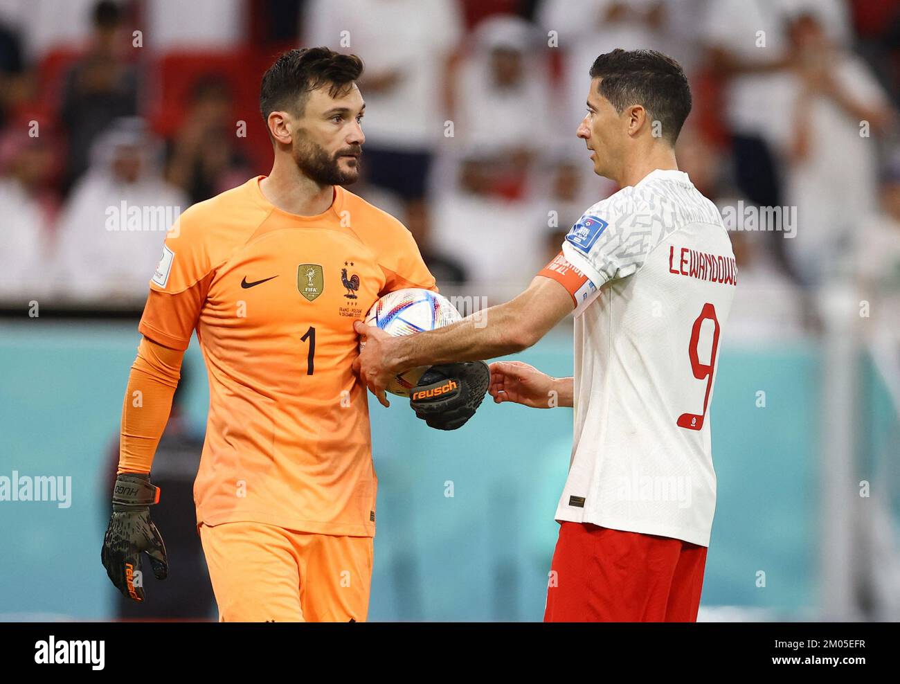 Soccer Football - FIFA World Cup Qatar 2022 - Round of 16 - France v Poland  - Al Thumama Stadium, Doha, Qatar - December 4, 2022 Poland's Robert  Lewandowski retrieves the ball