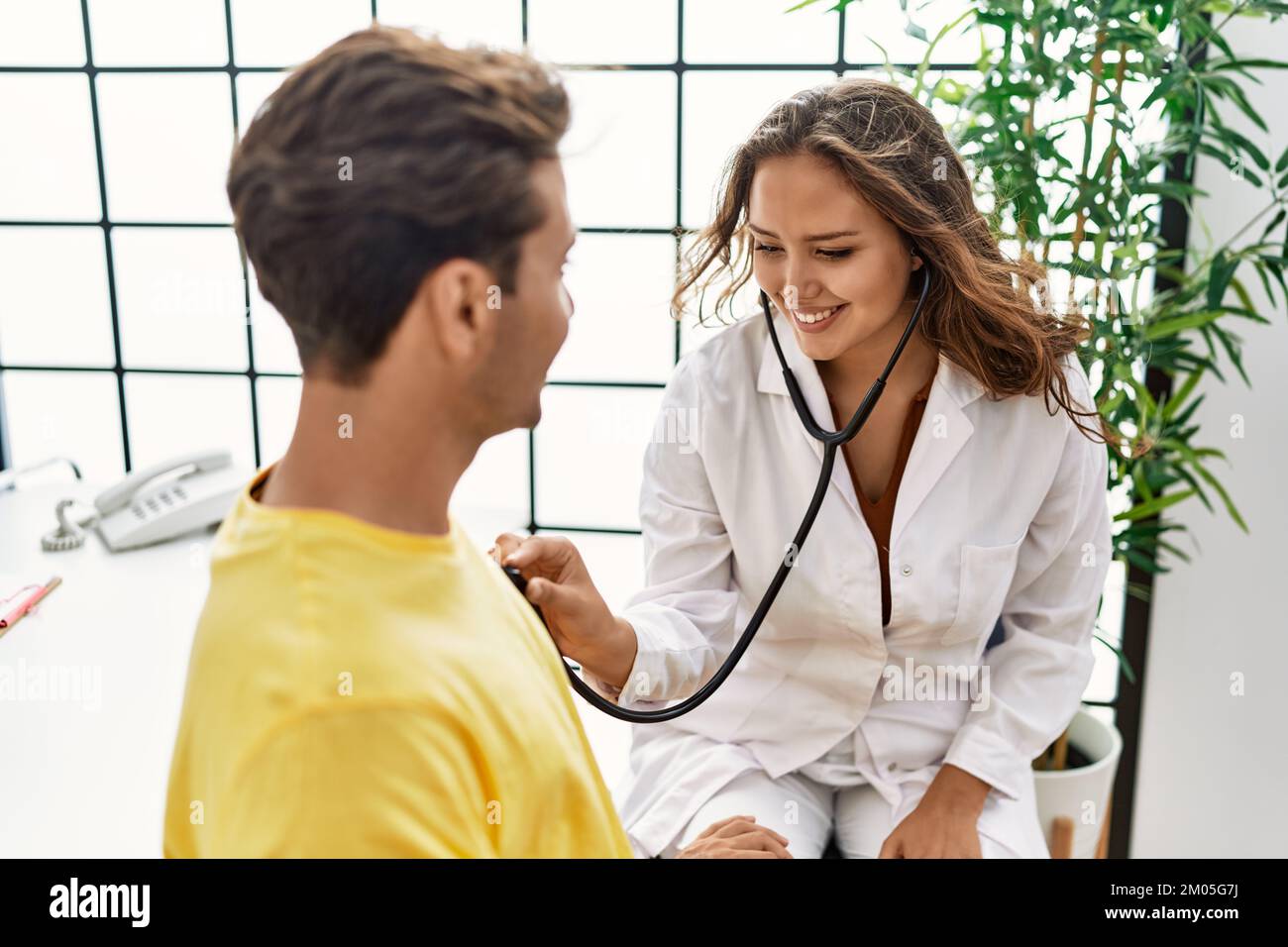 Female doctor using stethoscope hispanic hi-res stock photography and ...