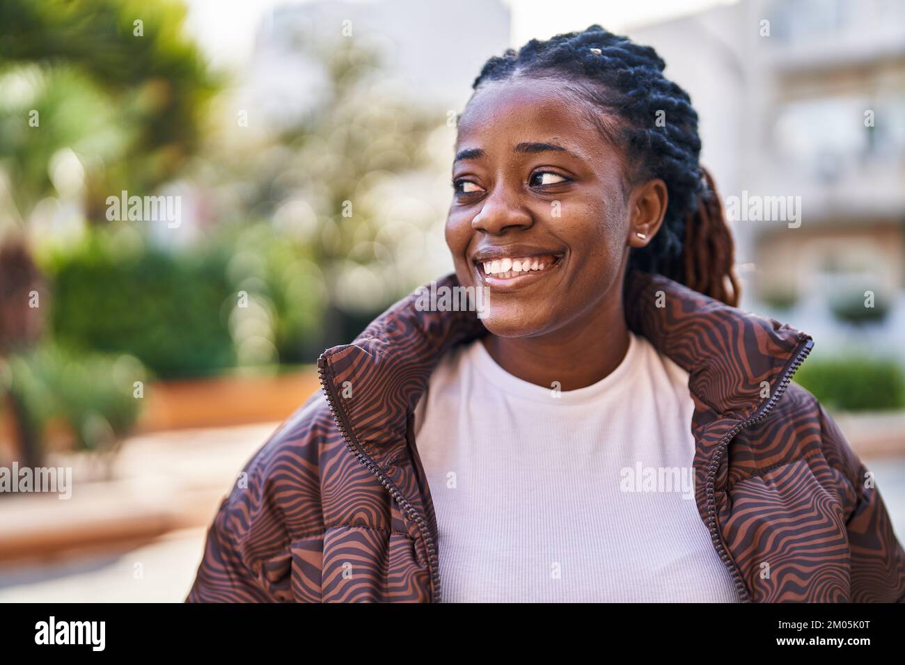 African american woman smiling confident looking to the side at park ...