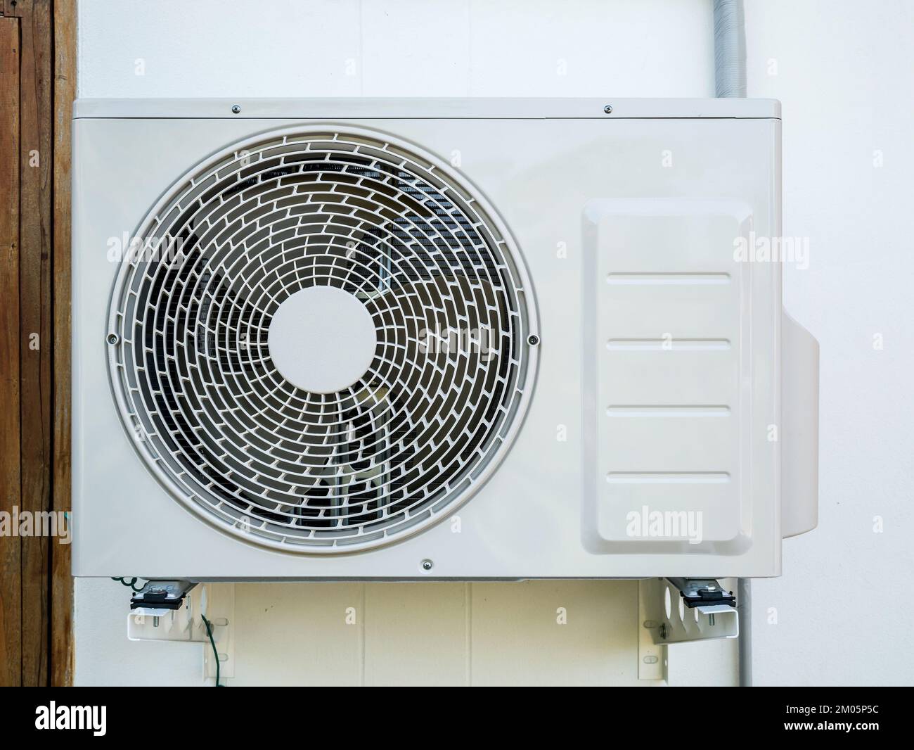 outdoor air conditioning unit on the wall Stock Photo Alamy