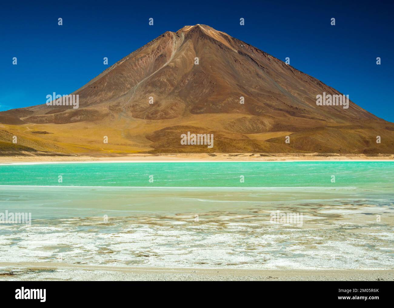 Licancabur  volcano and turquoise lagoon in Bolivia Stock Photo