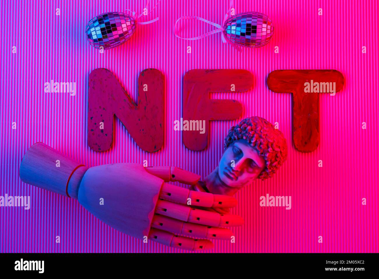 NFT symbol abstract concept in pink neon light. Non-fungible token, antique  sculpture, artificial hand and mirror eggs. Crypto Art Stock Photo - Alamy